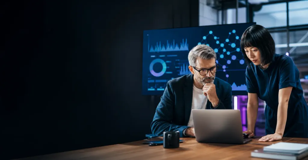 Generic editorial scene of business leaders reviewing an illustrative AI visibility dashboard