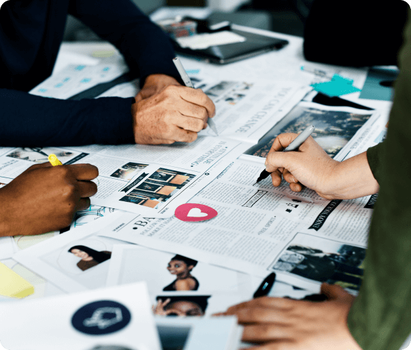 A team of professionals working together on a project, exchanging ideas and collaborating in a focused environment.