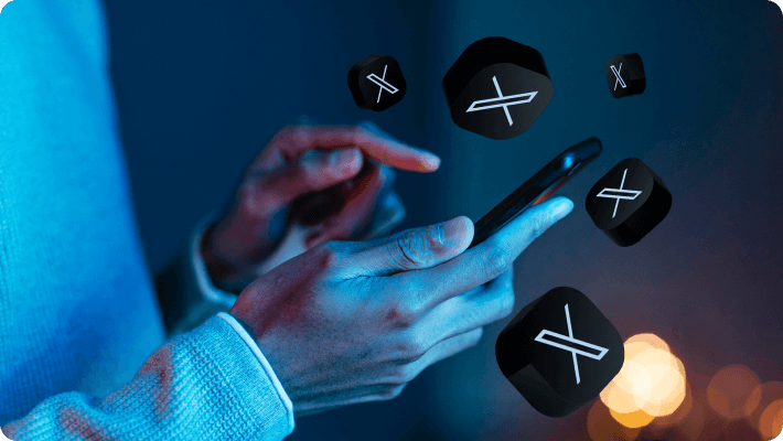 An individual grasping a mobile phone featuring multiple icons, representing a range of applications and digital interactions.